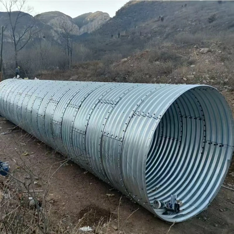First, the steel plates are carefully inspected upon arrival at the factory. The corrugated steel plates must comply with national regulations, with the waveform and waveform spacing strictly adhering to the design drawings. The length and width are determined based on dimensions, as well as lifting, transportation, and assembly conditions. The corrugated steel pipes, high-strength bolts, and nuts must undergo galvanized anti-corrosion treatment before leaving the factory. Each batch of goods is inspected and accompanied by product certificates.  Second, during the transportation and handling of metal corrugated pipe culverts, extra caution must be exercised. Rolling or impacting hard objects is strictly prohibited to prevent deformation of the corrugated pipe walls or damage to the galvanized layer.  Third, after arriving at the construction site, the dimensions of each piece must be inspected. A random sample of plates and high-strength bolts from the metal corrugated pipe culvert should be selected for testing, including checks on dimensions, corrosion resistance, strength, and other relevant items. The test results must comply with national requirements.  Fourth, after inspection, store the materials in a well-ventilated and spacious area. Protective measures should be taken to prevent the metal corrugated pipes from being soaked by rainwater, which could cause deformation.